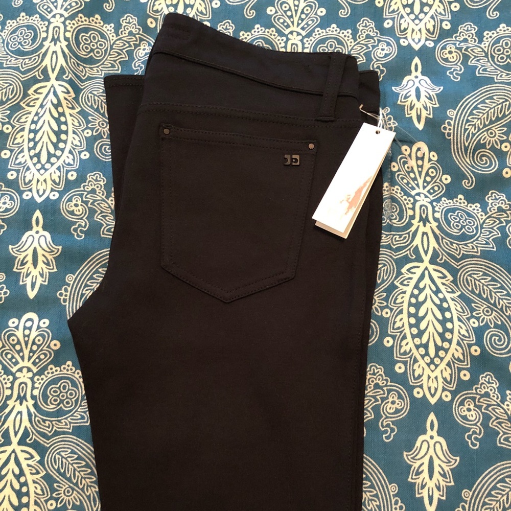 A pair of Joe’s Jeans black skinny pants. NWT